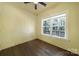 Cozy bedroom with ample natural light and hardwood floors. Ceiling fan included at 333 Anne Ave, Waxhaw, NC 28173
