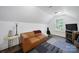 Bonus room with vaulted ceilings, plush sofa, and plenty of natural light at 333 Anne Ave, Waxhaw, NC 28173