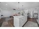 Bright kitchen featuring a large island, modern appliances, and an open layout that seamlessly connects to the living area at 333 Anne Ave, Waxhaw, NC 28173