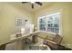 Virtually staged home office featuring a modern desk, comfortable chair, and a large window providing natural light at 333 Anne Ave, Waxhaw, NC 28173