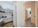 Pantry area featuring open shelving and wood floors provides ample storage at 333 Anne Ave, Waxhaw, NC 28173