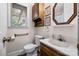Bathroom with sink, toilet, and window providing natural light at 36433 Azalea Cir, New London, NC 28127