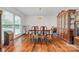 Traditional dining room with hardwood floors, table with chairs, and cabinet at 36433 Azalea Cir, New London, NC 28127
