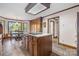Bright kitchen with center island, built-in cabinets, and a breakfast table by the window at 36433 Azalea Cir, New London, NC 28127