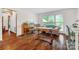 Cozy living room with hardwood floors, large windows, and neutral tones at 36433 Azalea Cir, New London, NC 28127