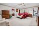 Traditional primary bedroom with a four-poster bed, neutral carpet, and walk-in closet at 36433 Azalea Cir, New London, NC 28127