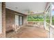Covered porch featuring outdoor furniture and a ceiling fan at 36433 Azalea Cir, New London, NC 28127