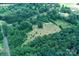 Expansive aerial view of the parcel with a mix of cleared and wooded areas, fully bordered for privacy at 4171 Leatherman Rd, Vale, NC 28168