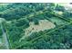 Expansive aerial view of the parcel with a mix of cleared and wooded areas, fully bordered for privacy at 4171 Leatherman Rd, Vale, NC 28168