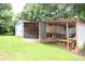 An open air wood and metal barn with work space on a green grass lawn at 4171 Leatherman Rd, Vale, NC 28168