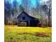 An old rustic barn with horses in the adjacent meadow at 4171 Leatherman Rd, Vale, NC 28168