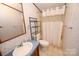Modest bathroom with vanity, toilet, and shower with curtain at 4171 Leatherman Rd, Vale, NC 28168