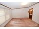 Unfurnished bedroom with light colored walls, brown carpet and view to kitchen at 4171 Leatherman Rd, Vale, NC 28168