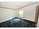 Simple bedroom with a window providing natural light and blue carpet at 4171 Leatherman Rd, Vale, NC 28168