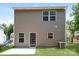 Exterior view of the back of the home with a sliding glass door and green backyard at 437 Danielle Way, Fort Mill, SC 29715