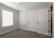 An airy bedroom features neutral walls, carpet flooring, and a large closet at 437 Danielle Way, Fort Mill, SC 29715