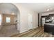 Open-concept kitchen featuring stainless steel appliances, dark cabinetry, and wood flooring at 437 Danielle Way, Fort Mill, SC 29715