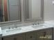 Bathroom with double sinks and a marble countertop providing ample space at 5855 Amity Springs Dr, Charlotte, NC 28212