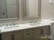 A bathroom featuring a double sink vanity with nice fixtures and countertops at 5855 Amity Springs Dr, Charlotte, NC 28212