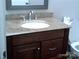 Cozy bathroom with a wooden vanity, granite countertops and a modern faucet at 5855 Amity Springs Dr, Charlotte, NC 28212