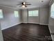 Spacious bedroom with natural light, ceiling fan and hardwood floors at 5855 Amity Springs Dr, Charlotte, NC 28212