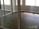 Bright bedroom with hardwood floors, natural light from windows and access to the outside via sliding glass doors at 5855 Amity Springs Dr, Charlotte, NC 28212