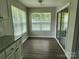 Dining area featuring hardwood floors, a breakfast bar, and natural light at 5855 Amity Springs Dr, Charlotte, NC 28212