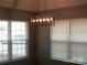 Dining room featuring two windows and a unique chandelier at 5855 Amity Springs Dr, Charlotte, NC 28212