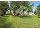 Spacious backyard with green grass and a shed at 6319 Welford Rd, Charlotte, NC 28211