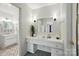 Bright bathroom with double vanity, white fixtures, and stylish decor at 6319 Welford Rd, Charlotte, NC 28211