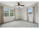 Bright bedroom with two windows and carpet at 6319 Welford Rd, Charlotte, NC 28211