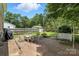 Backyard patio with brick pavers and swing at 6319 Welford Rd, Charlotte, NC 28211