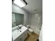 Bathroom featuring a tub and shower combo next to the vanity with a mirror at 6490 Alta Ctr, Denver, NC 28037