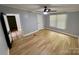 Bedroom features wood look flooring, neutral paint and a window for natural light at 6490 Alta Ctr, Denver, NC 28037
