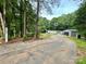Secluded home nestled in the trees with a long private driveway at 6490 Alta Ctr, Denver, NC 28037