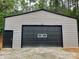Exterior view of the home's stand-alone metal garage building at 6490 Alta Ctr, Denver, NC 28037