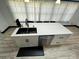 Beautiful kitchen island with stainless steel sink, modern fixtures, and sleek cabinetry at 6490 Alta Ctr, Denver, NC 28037