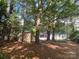 Backyard of home with shed and lots of trees at 709 Falls Church Rd, Charlotte, NC 28270
