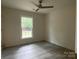 An inviting bedroom with natural light and hardwood style floors at 709 Falls Church Rd, Charlotte, NC 28270