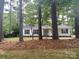 Charming home with trees in the front yard provides shade at 709 Falls Church Rd, Charlotte, NC 28270