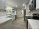 Spacious kitchen featuring white cabinets, quartz countertops, and stainless appliances at 709 Falls Church Rd, Charlotte, NC 28270