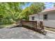 Inviting back patio with a jacuzzi and a wooden deck area for relaxation and entertainment at 727 W Main Street Ext, Lincolnton, NC 28092