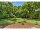 Expansive backyard with lush greenery, mature trees, and privacy, perfect for outdoor enjoyment at 727 W Main Street Ext, Lincolnton, NC 28092
