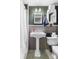 Cozy bathroom with classic fixtures, a pedestal sink, and a neutral color scheme at 727 W Main Street Ext, Lincolnton, NC 28092