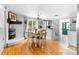 Bright dining area with hardwood floors, a decorative fireplace, and access to the kitchen at 727 W Main Street Ext, Lincolnton, NC 28092