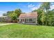 Charming home with a red roof, a cozy porch, and a well-manicured front lawn at 727 W Main Street Ext, Lincolnton, NC 28092