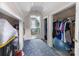 Hallway leading to bathroom with closets, showcasing the home's practical storage solutions at 727 W Main Street Ext, Lincolnton, NC 28092