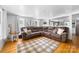 Comfortable living room featuring hardwood floors, a large sectional sofa, and plenty of natural light at 727 W Main Street Ext, Lincolnton, NC 28092