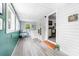 Bright sunroom with vinyl floors, lots of natural light, and a view of the backyard at 727 W Main Street Ext, Lincolnton, NC 28092