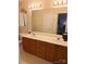 Bathroom with a double sink vanity and ample lighting at 7857 Petrea Ln, Charlotte, NC 28227